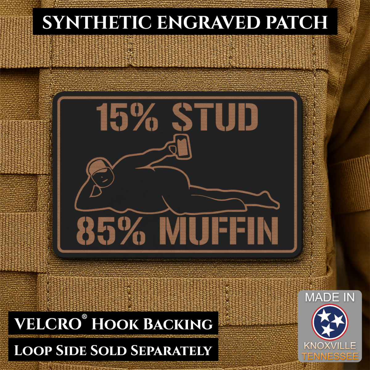 15% Stud 85% Muffin Funny Dad Bod laser-engraved synthetic morale patch: a rectangular black synthetic patch with tan engraved text and graphic, shown attached to tan tactical vest fabric. The patch reads “15% STUD 85% MUFFIN” with.