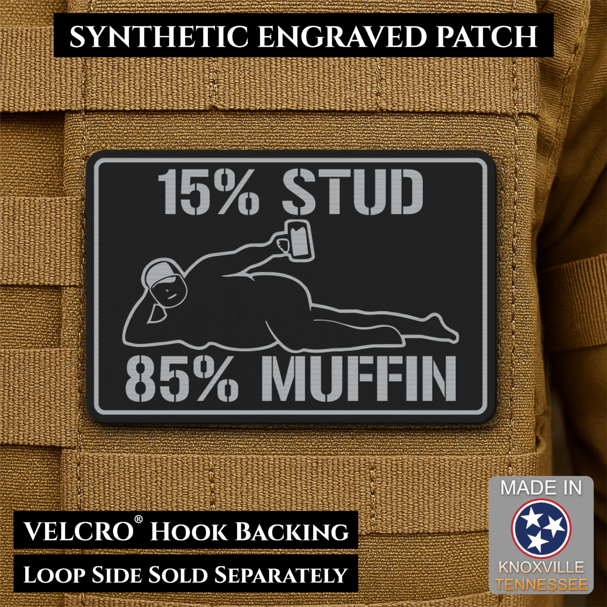 15% Stud 85% Muffin Funny Dad Bod laser-engraved synthetic morale patch: a rectangular black synthetic patch with white engraved text reading “15% STUD 85% MUFFIN” and a white reclining figure graphic, shown attached to tan.
