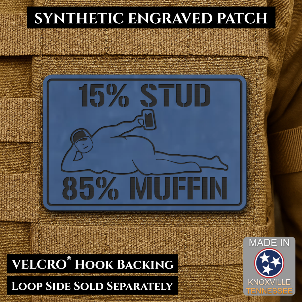 15% Stud 85% Muffin Funny Dad Bod laser-engraved synthetic morale patch: a rectangular blue synthetic engraved patch mounted on tan tactical webbing. The patch reads “15% STUD 85% MUFFIN” with a reclining figure holding a phone.