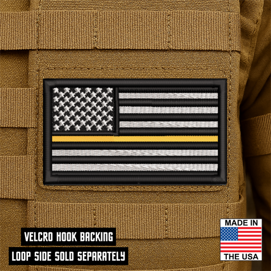 Thin Yellow Line American Flag embroidered tactical morale patch with hook backing attached to tactical vest