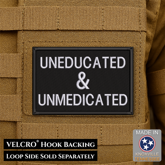 A rectangular black tactical patch with white embroidered text reading 'UNEDUCATED & UNMEDICATED' attached to tan coyote-brown MOLLE webbing. Text at the bottom notes VELCRO hook backing and loop side sold separately, with a small 'Made in Knoxville Tennessee' badge in the lower right.