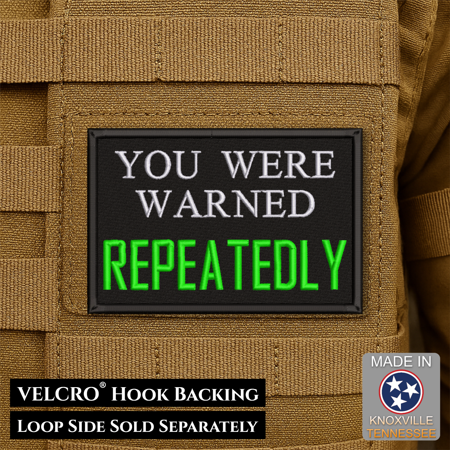A rectangular tactical patch with a black background and raised border, reading 'YOU WERE WARNED REPEATEDLY' in white and bright green text, shown attached to tan MOLLE webbing. Text at the bottom says VELCRO Hook Backing and Loop Side Sold Separately; a 'Made in Knoxville Tennessee' badge appears in the lower right.