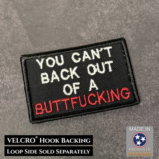 Embroidered patch with text on a gray background, featuring VELCRO hook backing.