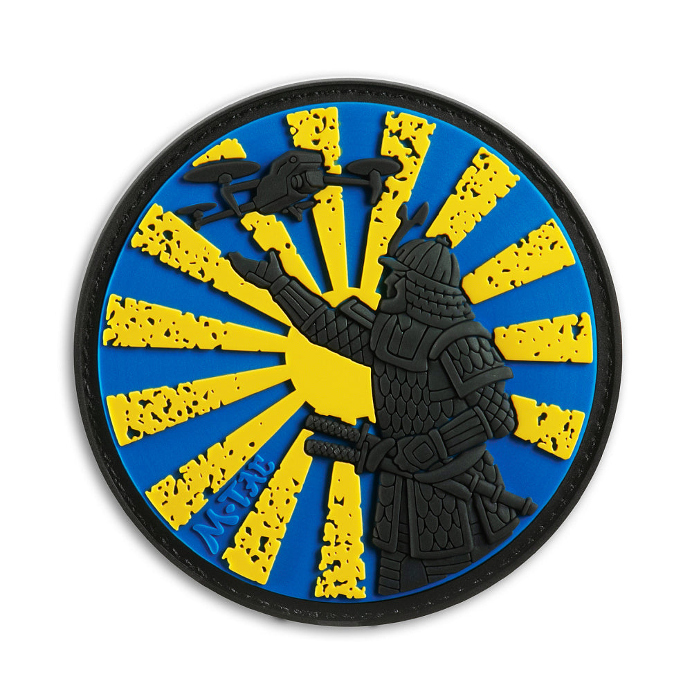 M-Tac Samurai Drone PVC morale patch featuring a samurai launching an FPV drone against a rising sun background with hook and loop backing.